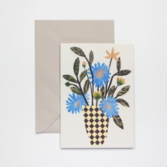 Greeting card featuring a collage of wild flowers in a simple chequer vase on a pale green background.