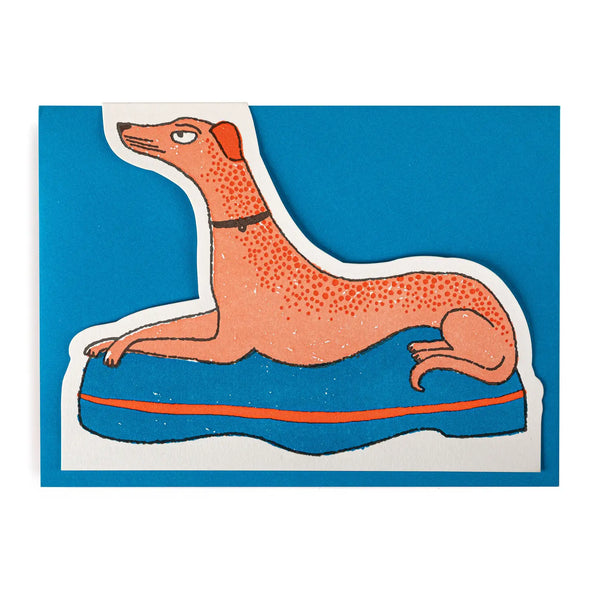 Cut-out card of dog with crossed paws