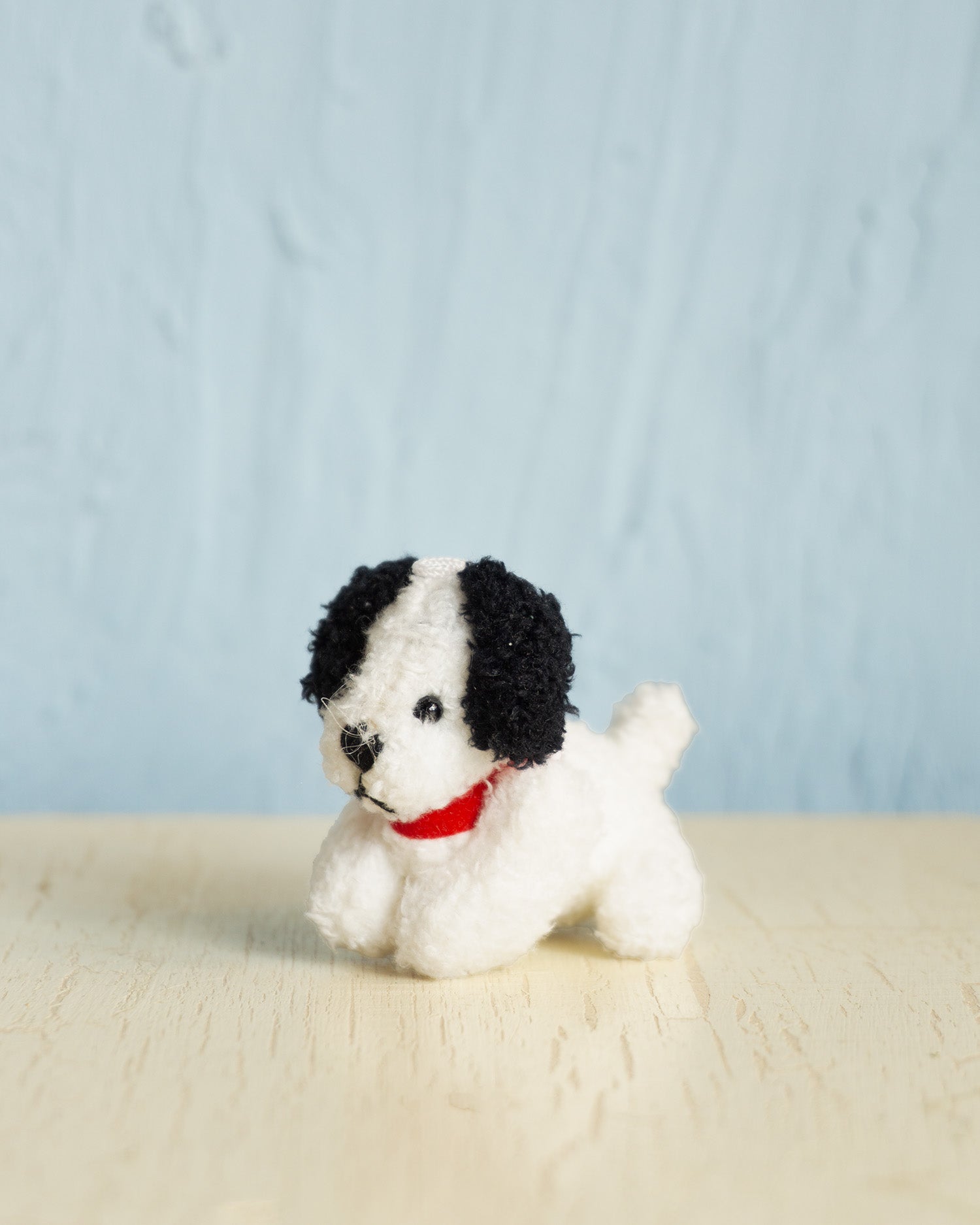 small charm - white puppy black ears