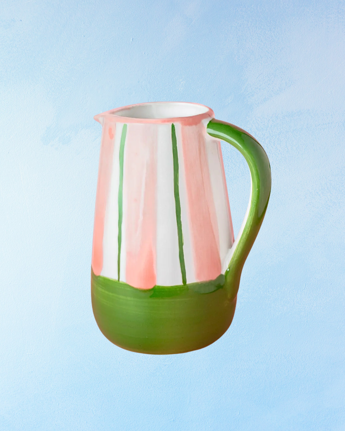 ceramic pitcher with white, green, and pink stripes, green bottom half, and green handle