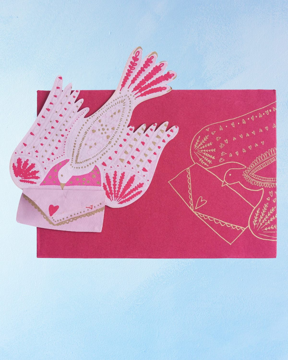 Decorative card with pink and white design on a light blue background