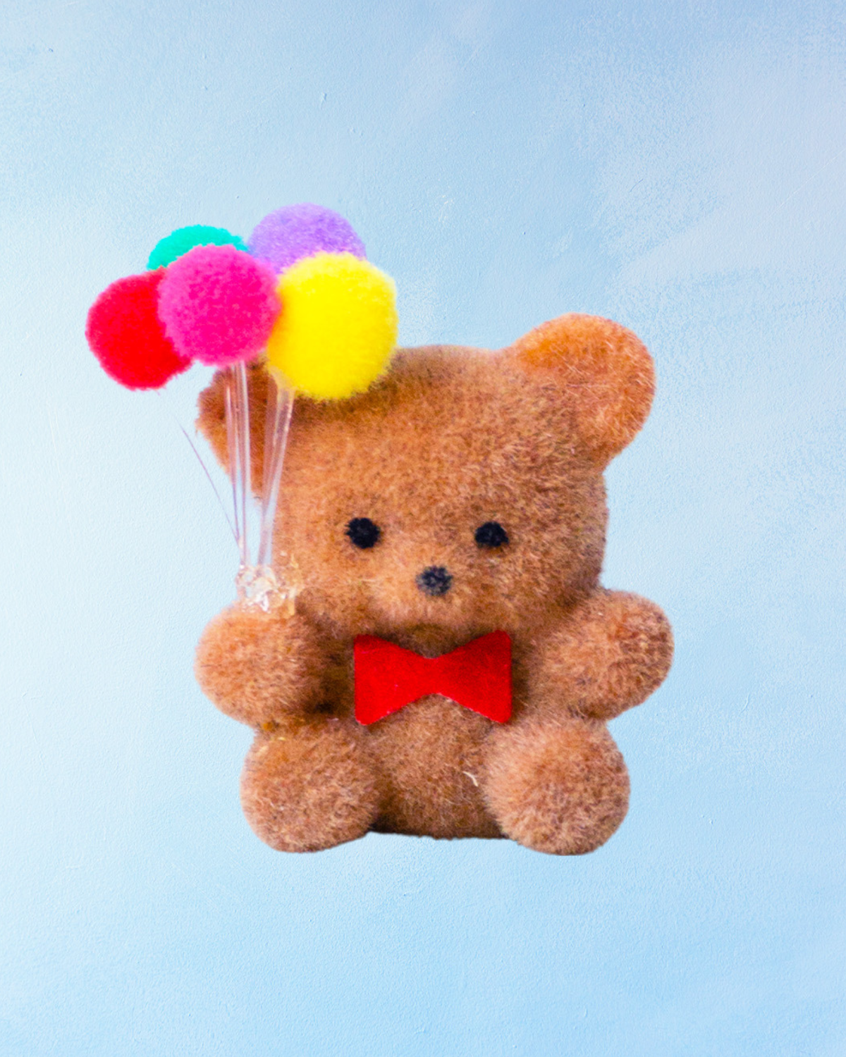 miniature flocked bear with balloons