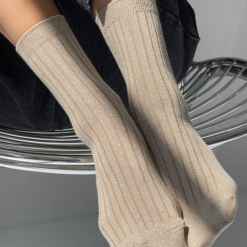 beige ribbed socks on someone's feet