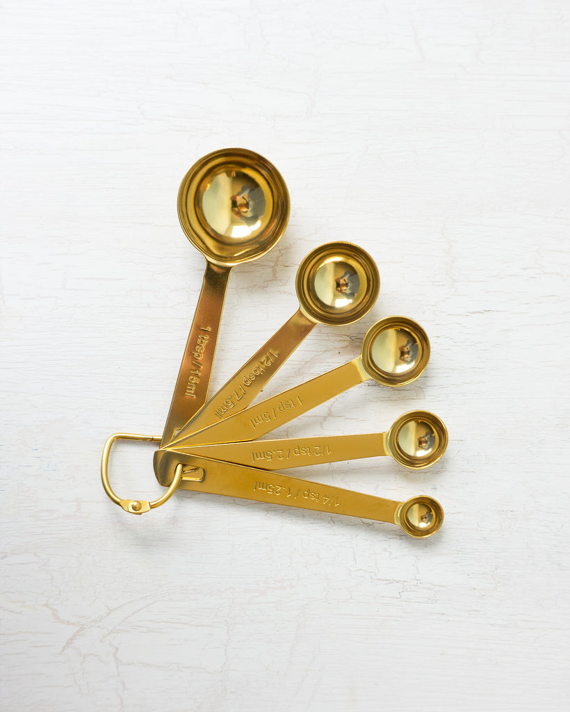 gold measuring spoons