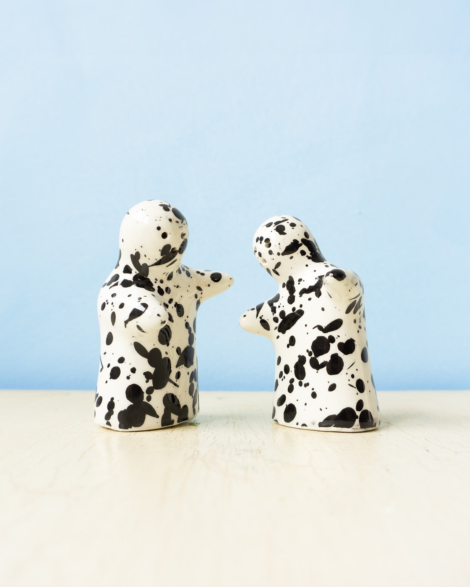 ceramic salt and pepper shakers - black and white galaxy