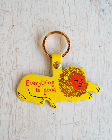 Leather Lion keychain that says everything is good