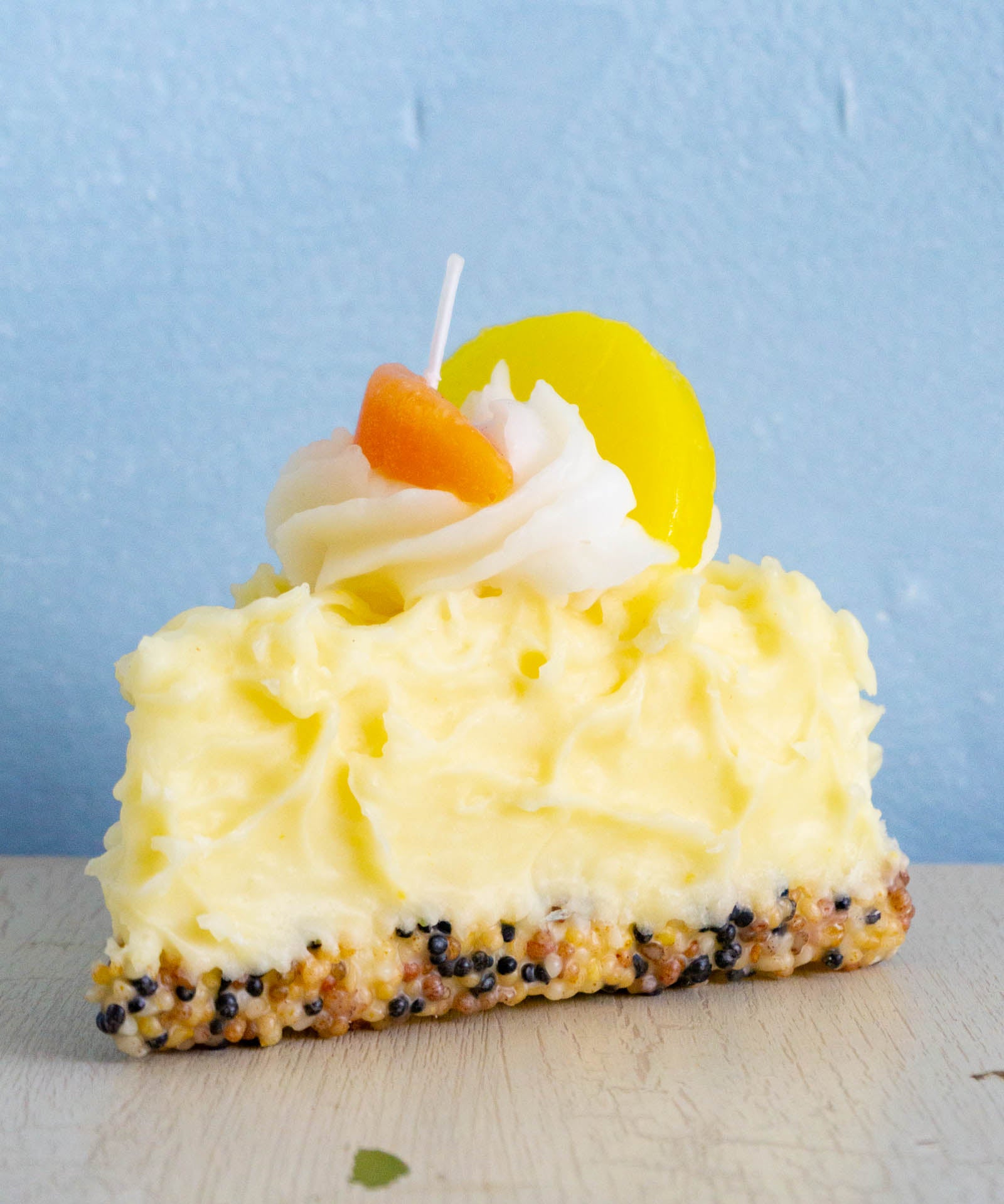 candle - food - slice of lemon chiffon cake
