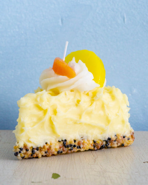 candle - slice of lemon chiffon cake