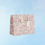 Sac cadeau moyen - terre rose (modèles variés)