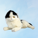 stuffed toy - white and black piebald cat: laying