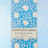 very slim list book -milky way blue and pink
