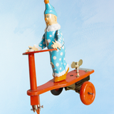 toy - tin clown on scooter