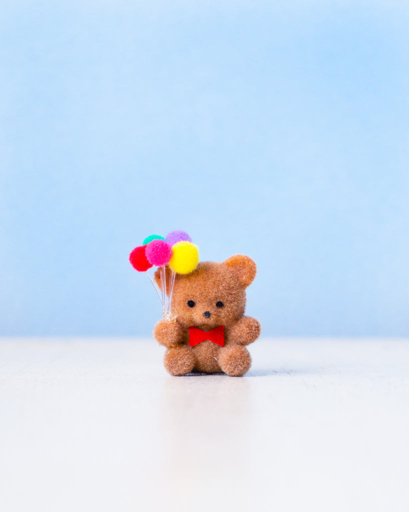 miniature flocked bear with balloons