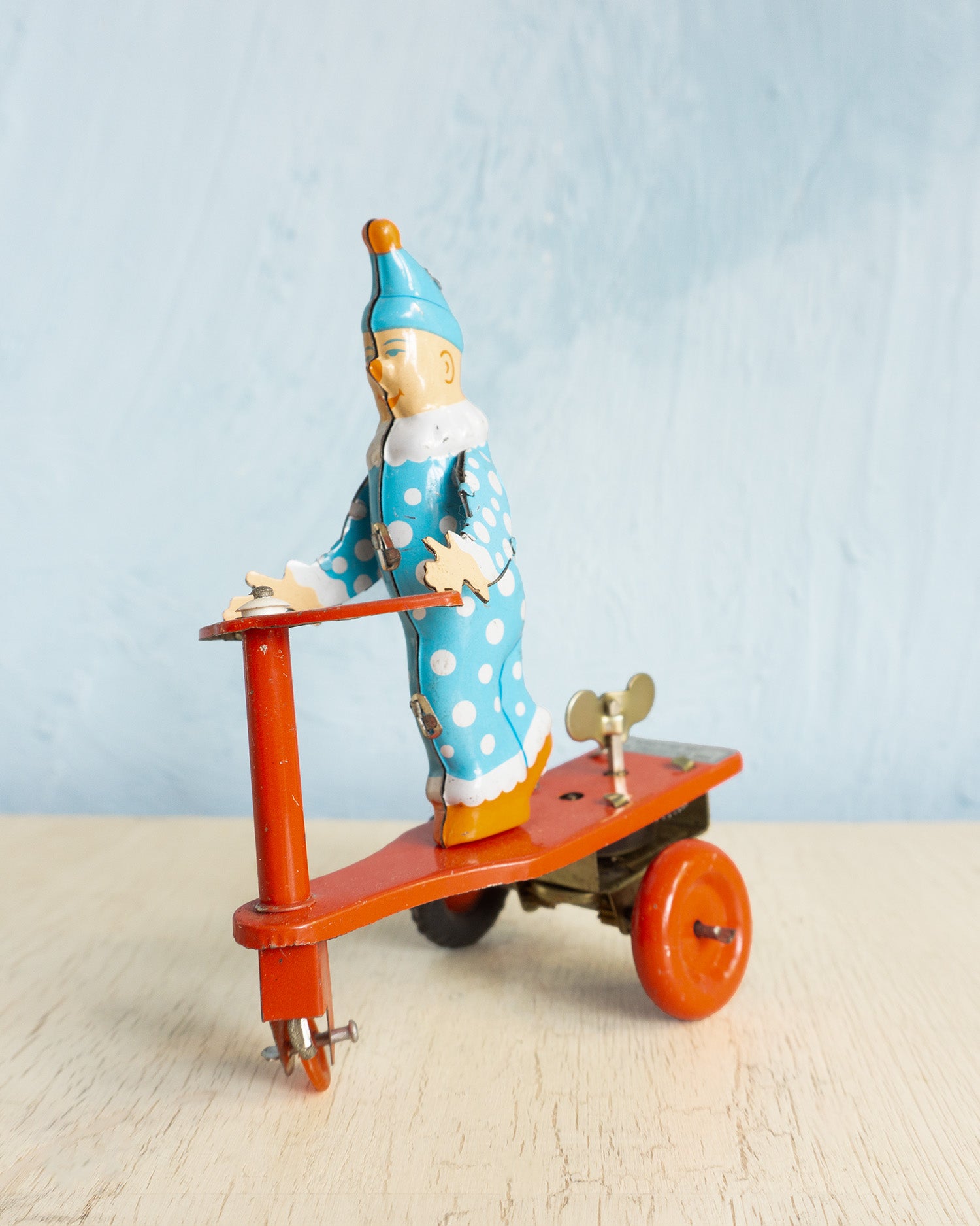 toy - tin clown on scooter