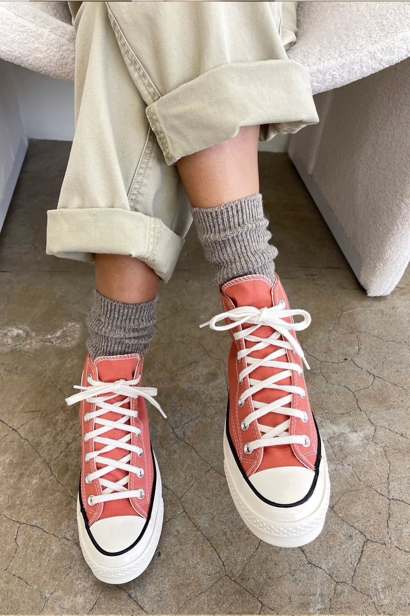 Person wearing coral high-top sneakers and Le Bon Shoppe Winter Glitter socks in Ash