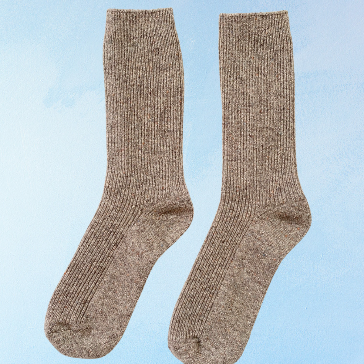 Pair of glittery brown socks on a light blue background. Le Bon Shoppe Winter Sparkle in Nutmeg.