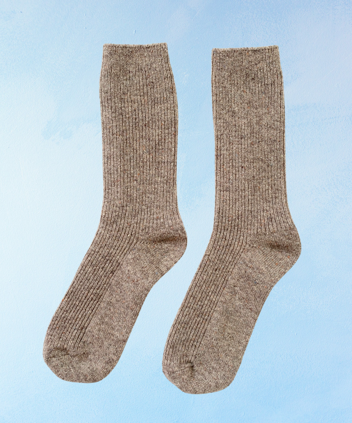 Pair of glittery brown socks on a light blue background. Le Bon Shoppe Winter Sparkle in Nutmeg.
