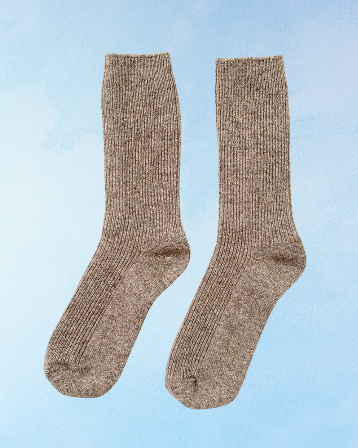 Pair of glittery brown socks on a light blue background. Le Bon Shoppe Winter Sparkle in Nutmeg.