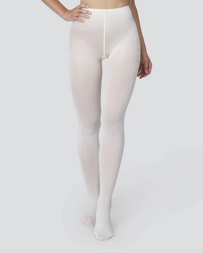 A model wearing Svea's Olivia ivory tights