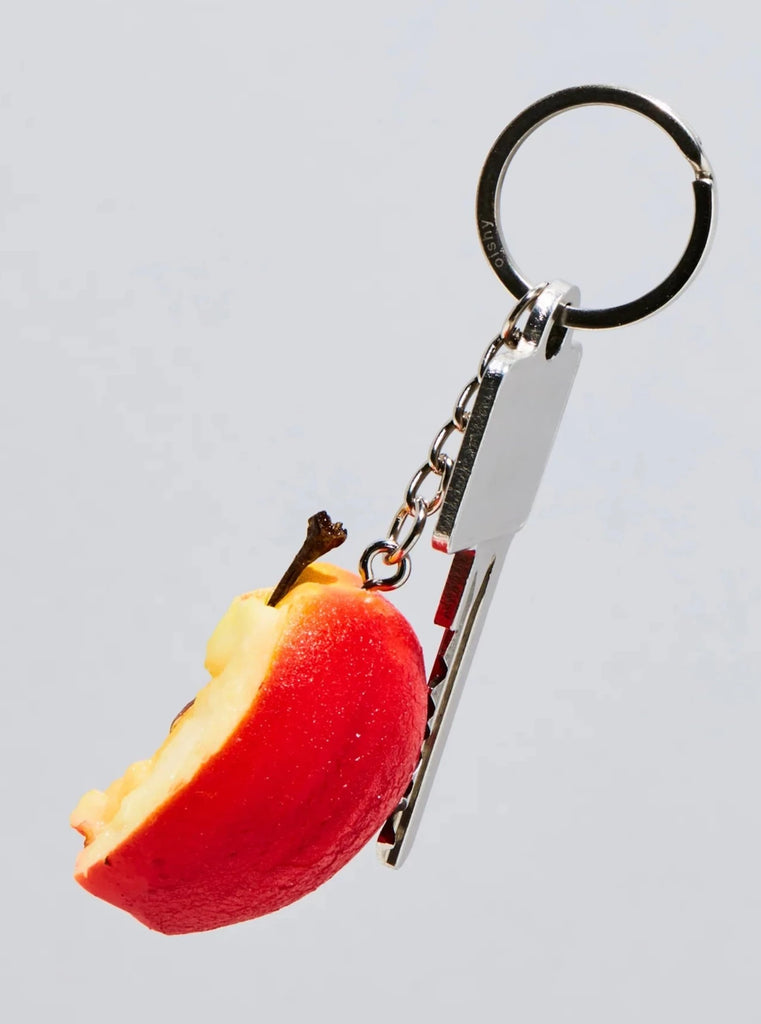 Realistic-looking resin half apple keychain with key