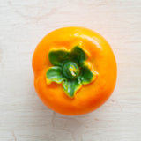 Cereria Introna candle shaped like a persimmon