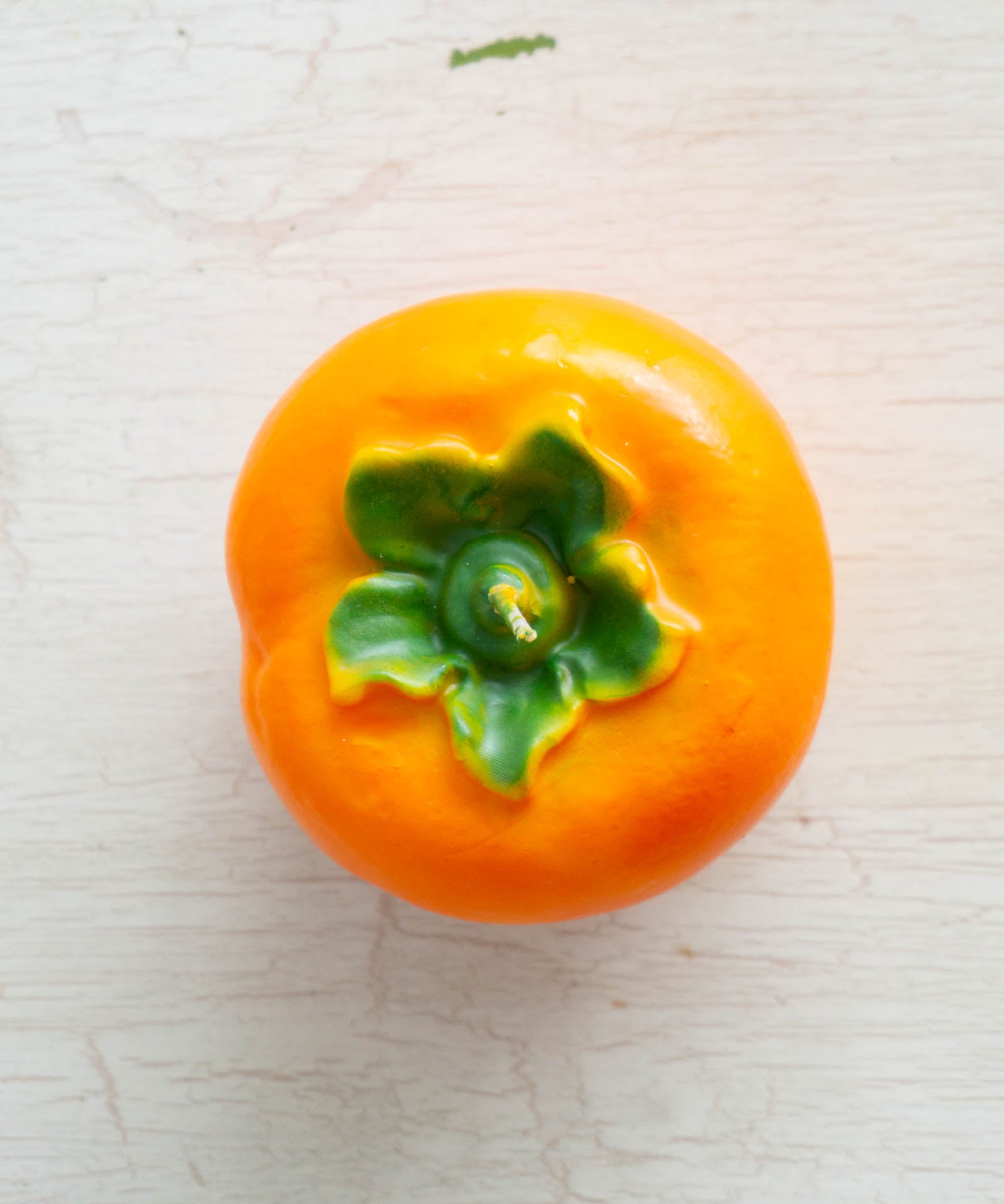 Cereria Introna candle shaped like a persimmon