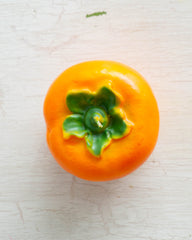 Cereria Introna candle shaped like a persimmon