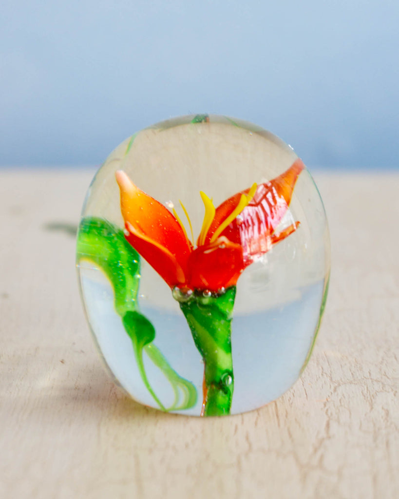 Vintage glass paper weight with a red flower
