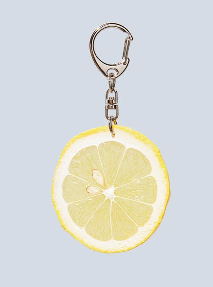 Realistic-looking slice of lemon keychain.