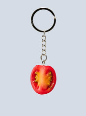 Realistic-looking quartered cherry tomato keychain. 