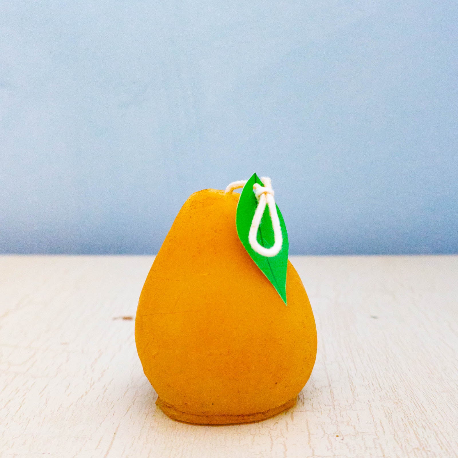 Beeswax candle shaped like a pear