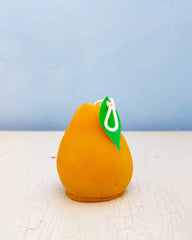 Beeswax candle shaped like a pear