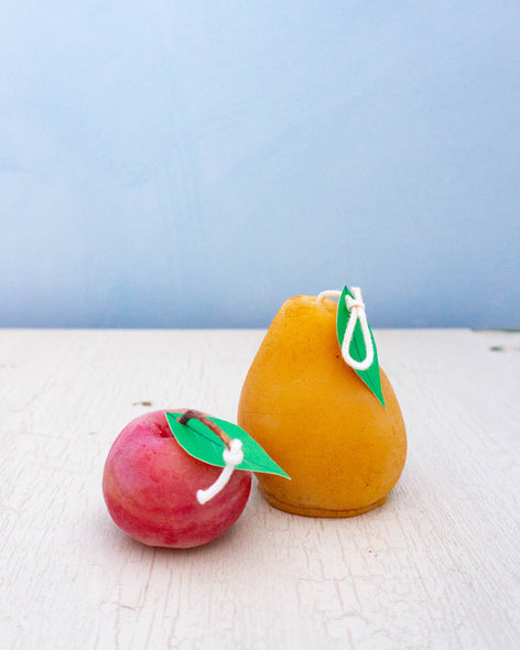 Beeswax candles shaped like an apple and a pear
