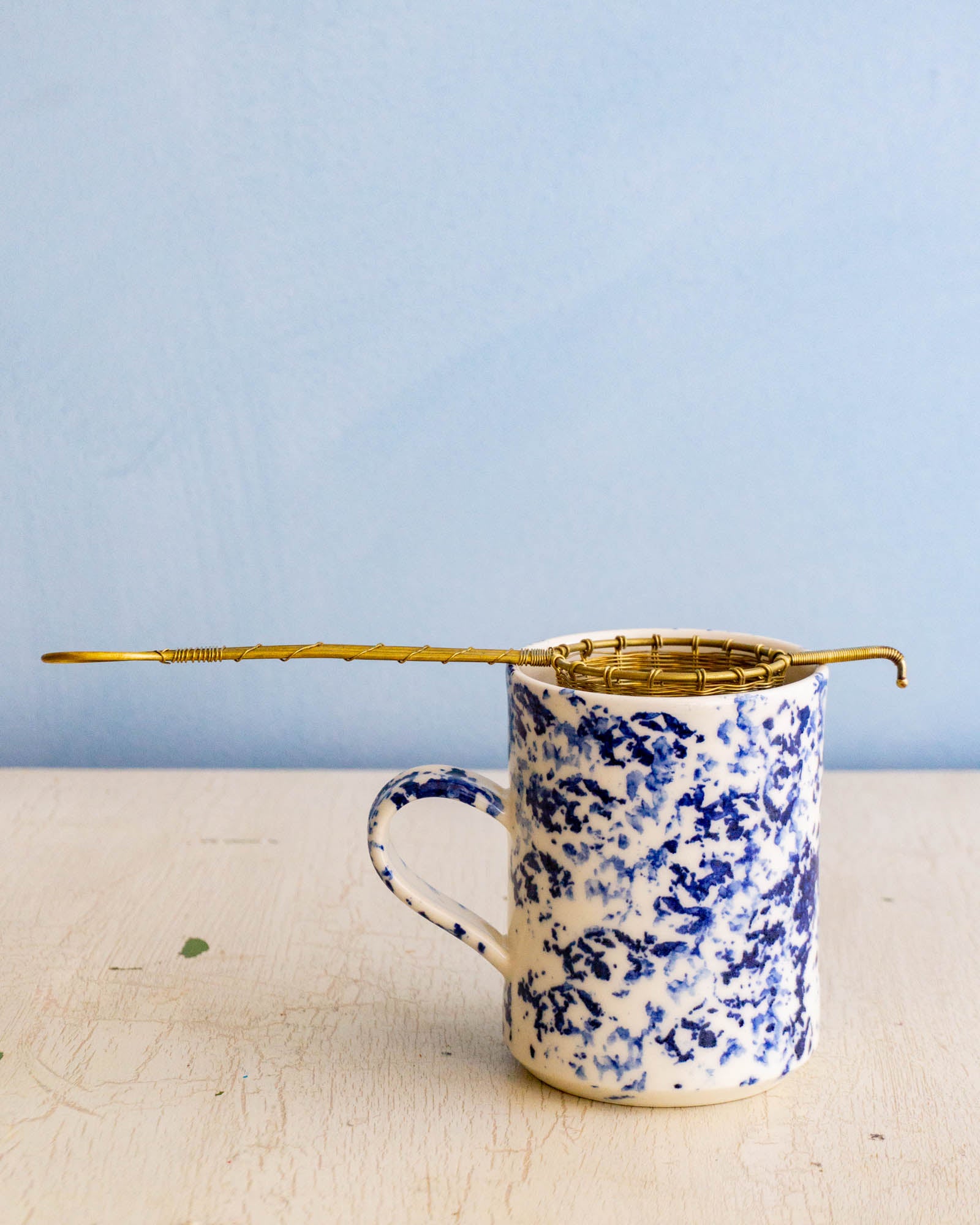 Brass Tea Basket over a Mug 