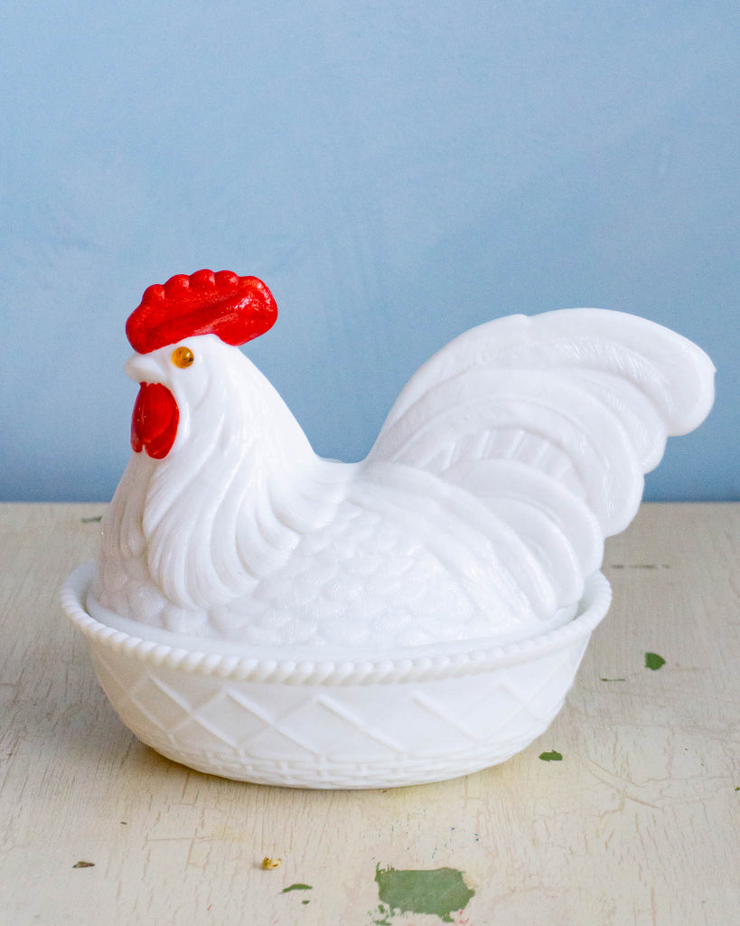 Antique milk glass dish in the shape of a chicken resting on its nest