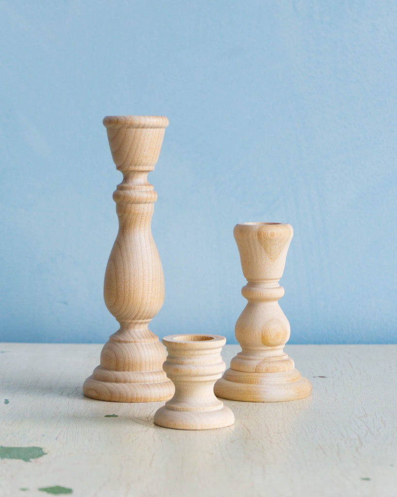 trio of wooden candleholders
