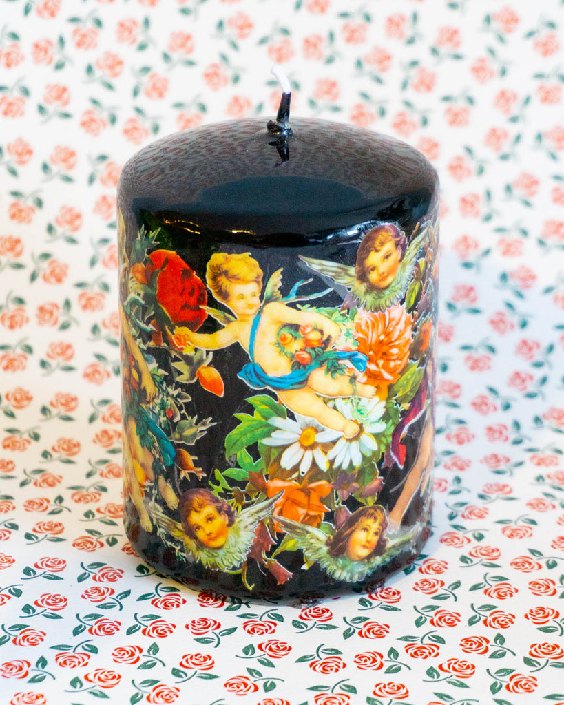 gothic black pillar candle with colourful cherubs and flowers