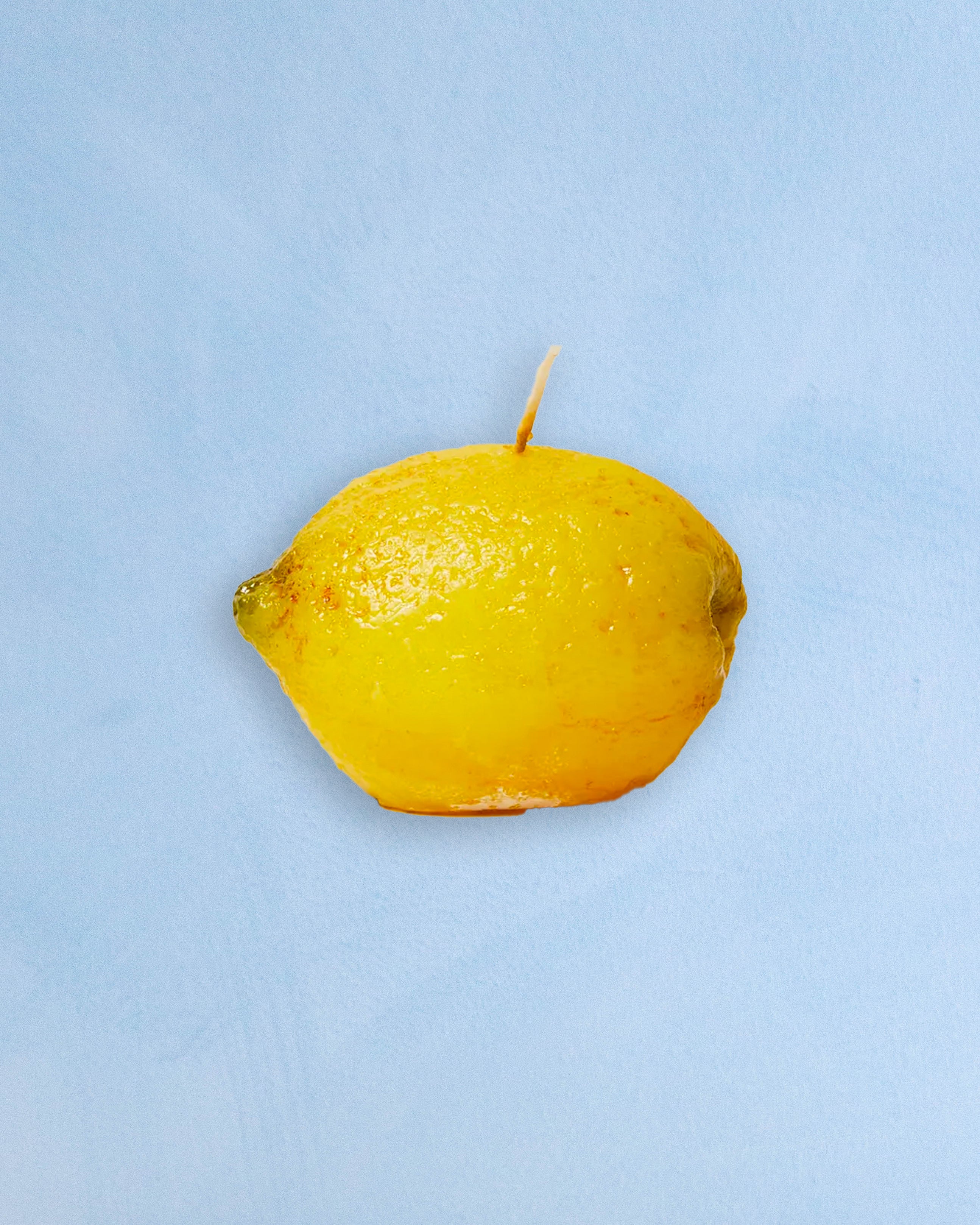 A candle shaped like a lemon 