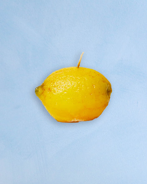 A candle shaped like a lemon 