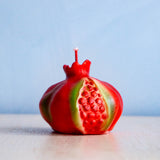 A candle shaped like a pomegranate