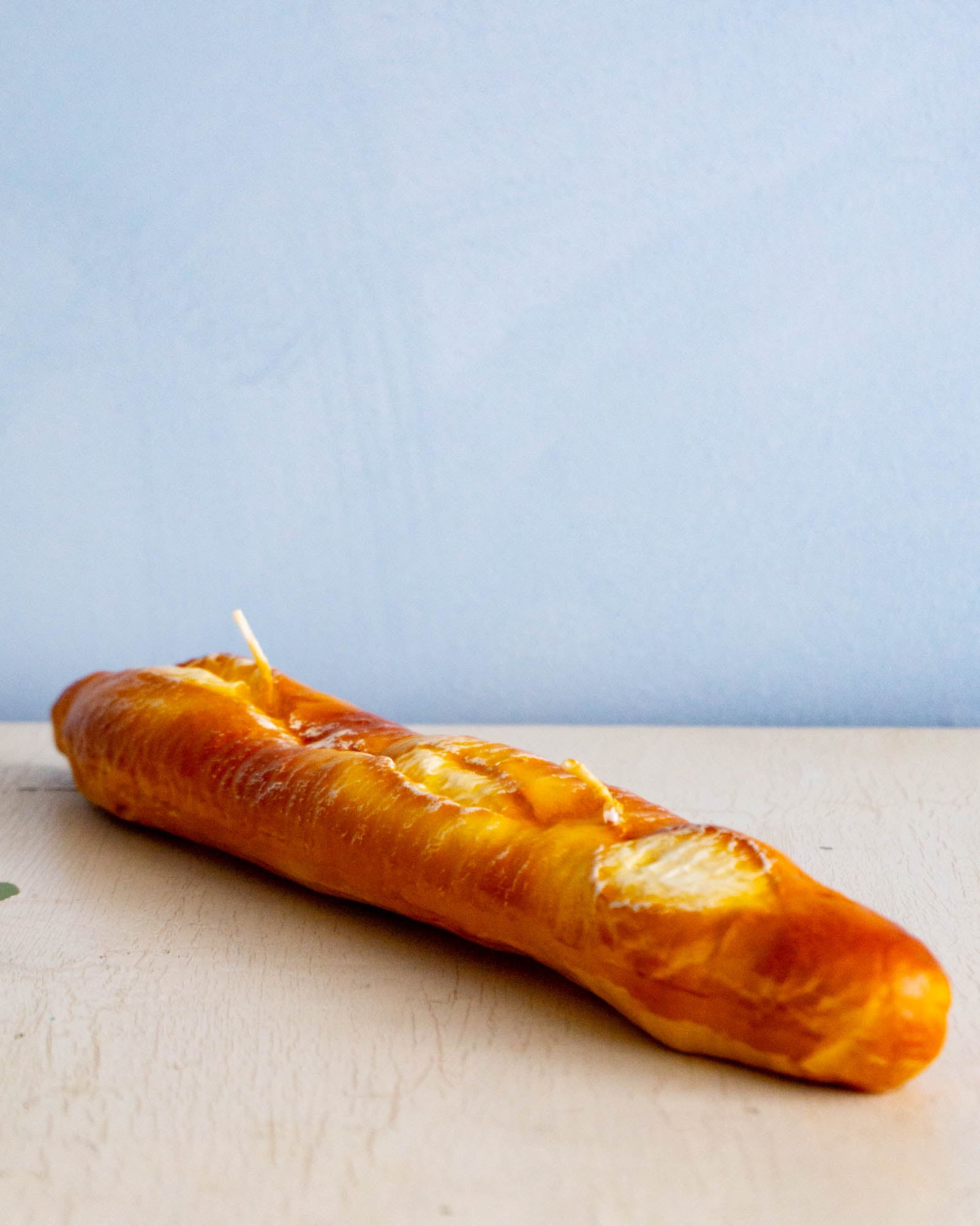 a candle shaped like a baguette 