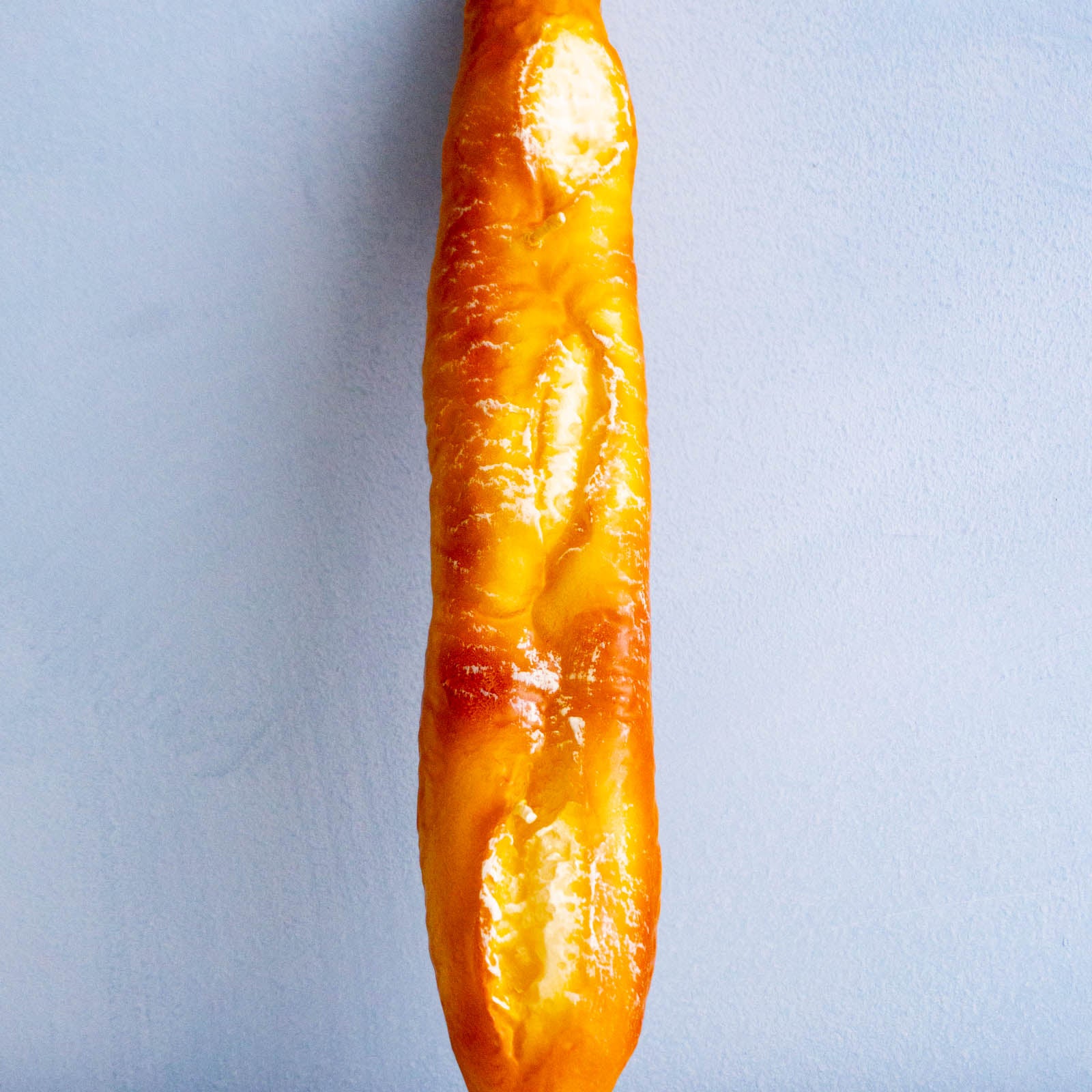 a candle shaped like a baguette 