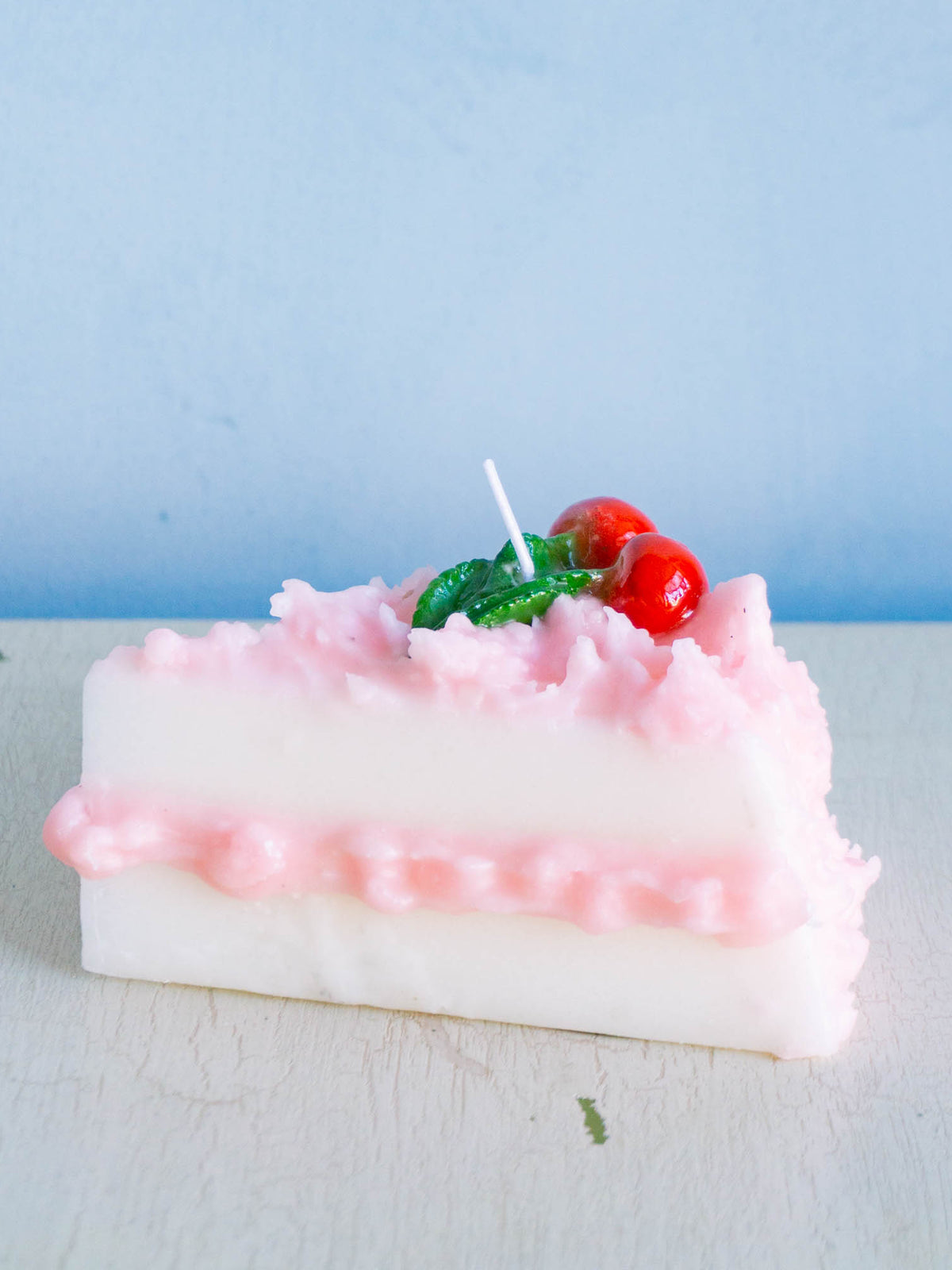 Cereria Introna candle shaped like a slice of cherry cake