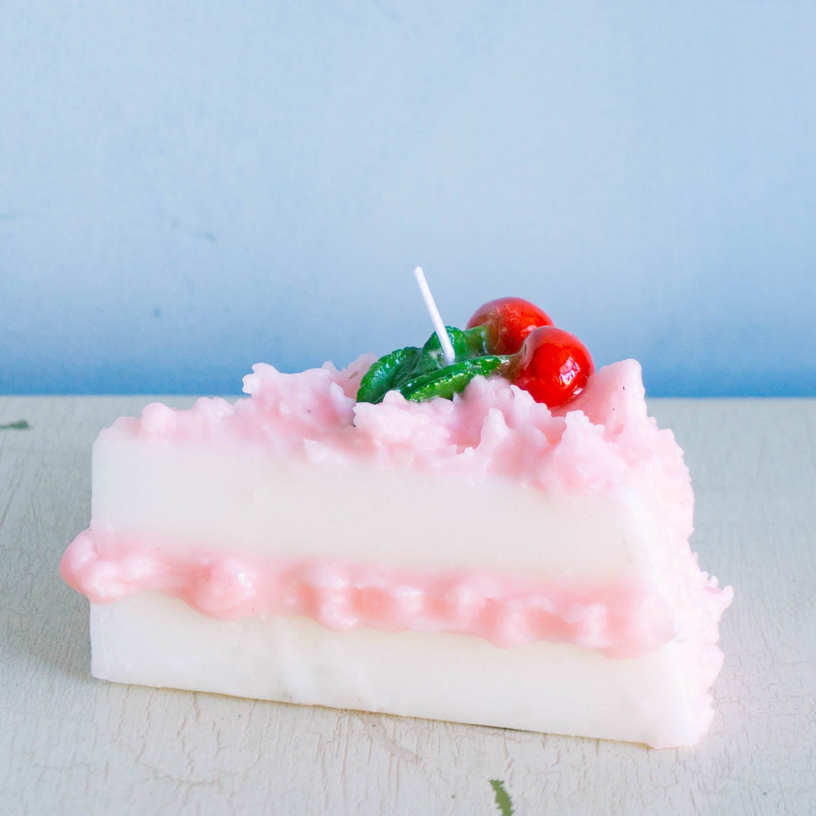 Cereria Introna candle shaped like a slice of cherry cake