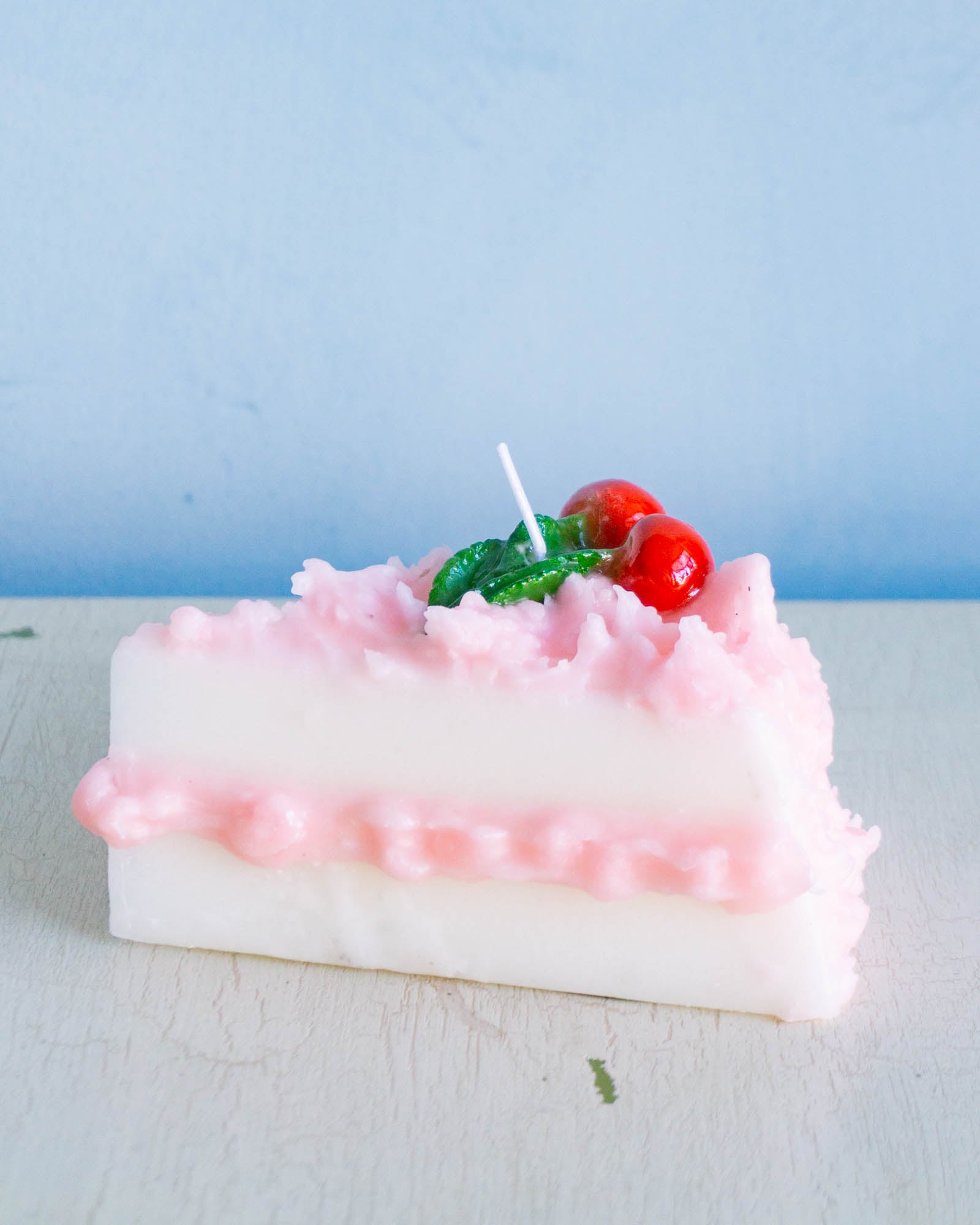 Cereria Introna candle shaped like a slice of cherry cake
