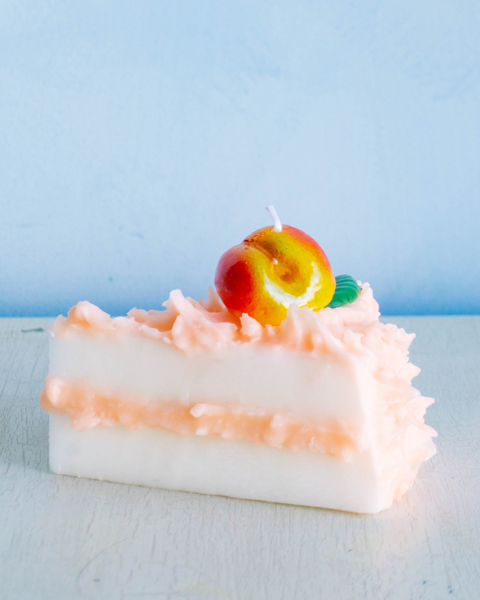 Cereria Introna candel shaped like a slice of peach cake 