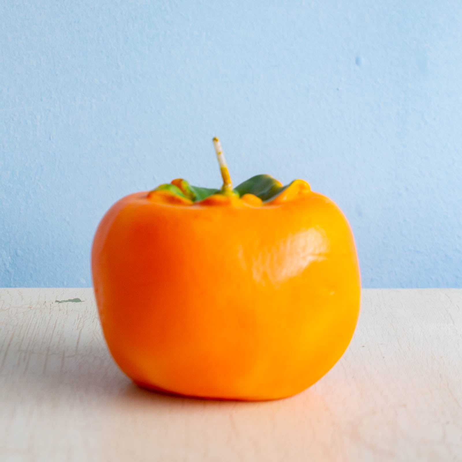 Cereria Introna candle shaped like a persimmon