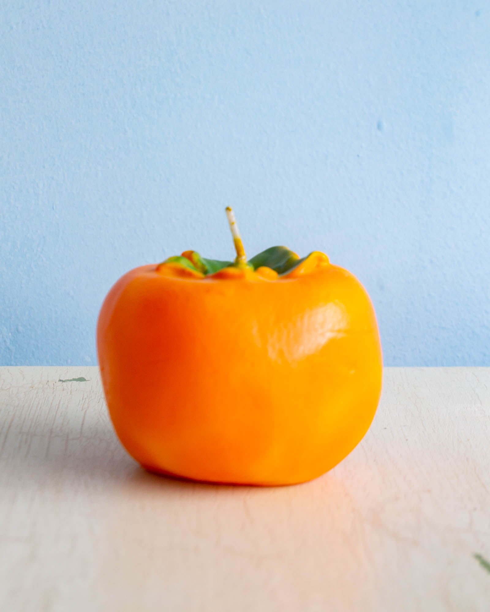 Cereria Introna candle shaped like a persimmon