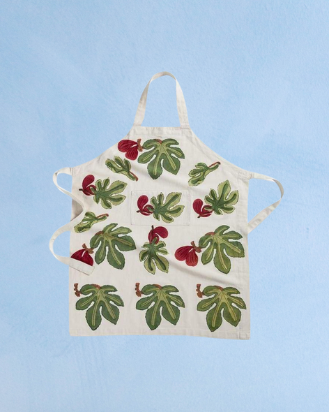 Cream apron featuring red figs & green fig leaf design by Couleur Nature.