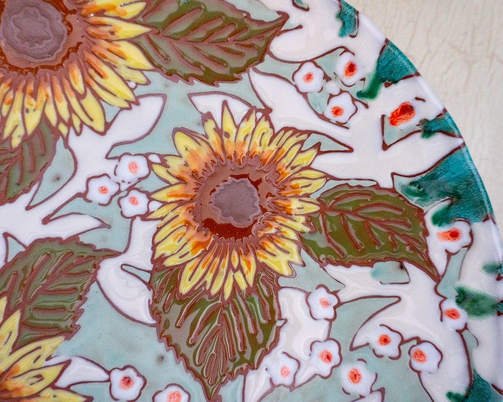 Close up on ceramic platter with sunflowers